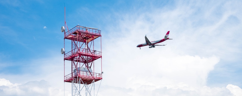 airplane-flying-through-cloudy-sky.jpg