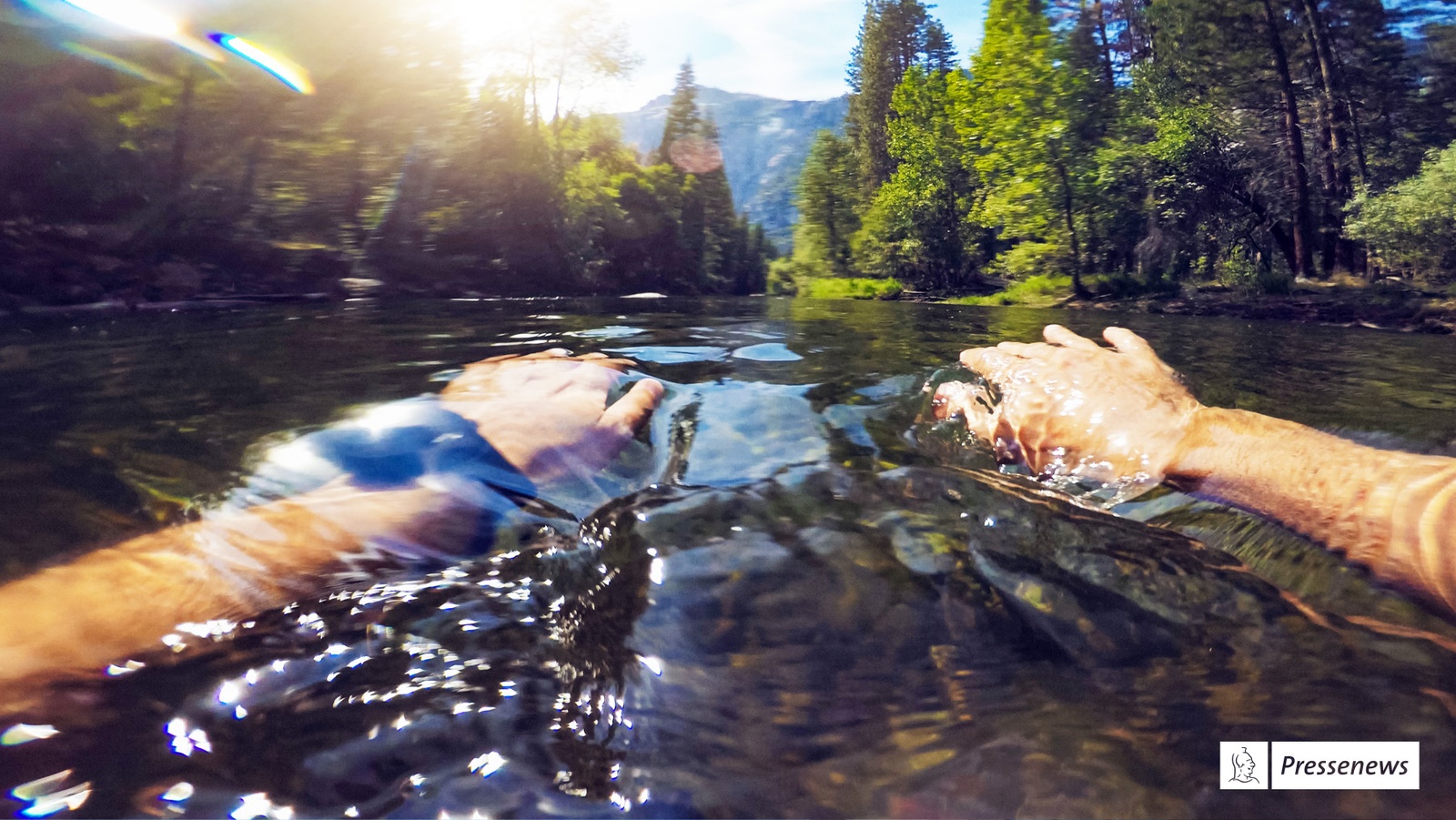 Foto eines Schwimmers in einem Gebirgsbach