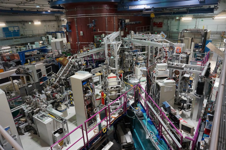 At the research reactor FRM-II, an intense source of low-energy positrons was developed and built. From the capture of thermal neutrons in the isotope 113Cd, photons in the energy range of a few MeV result. Electron-positron pairs are generated in a platinum foil via pair formation. The average kinetic energy of the positrons is 800 keV. After deceleration to thermal energy and diffusion to the surface, a part of the positrons is emitted with an energy approximately equal to the work function of this material. Thus, a positron beam can be formed by a suitable arrangement and focusing and guided out of the reactor region by a magnetic guide field. The achievable positron intensity scales with the thermal neutron flux at the location of the cadmium. At a thermal neutron flux of 10^12n/cm^2s, a positron intensity of 10^8 positrons per second was achieved. This enables novel investigation possibilities of solid surfaces with Auger electron spectroscopy induced by positron annihilation.